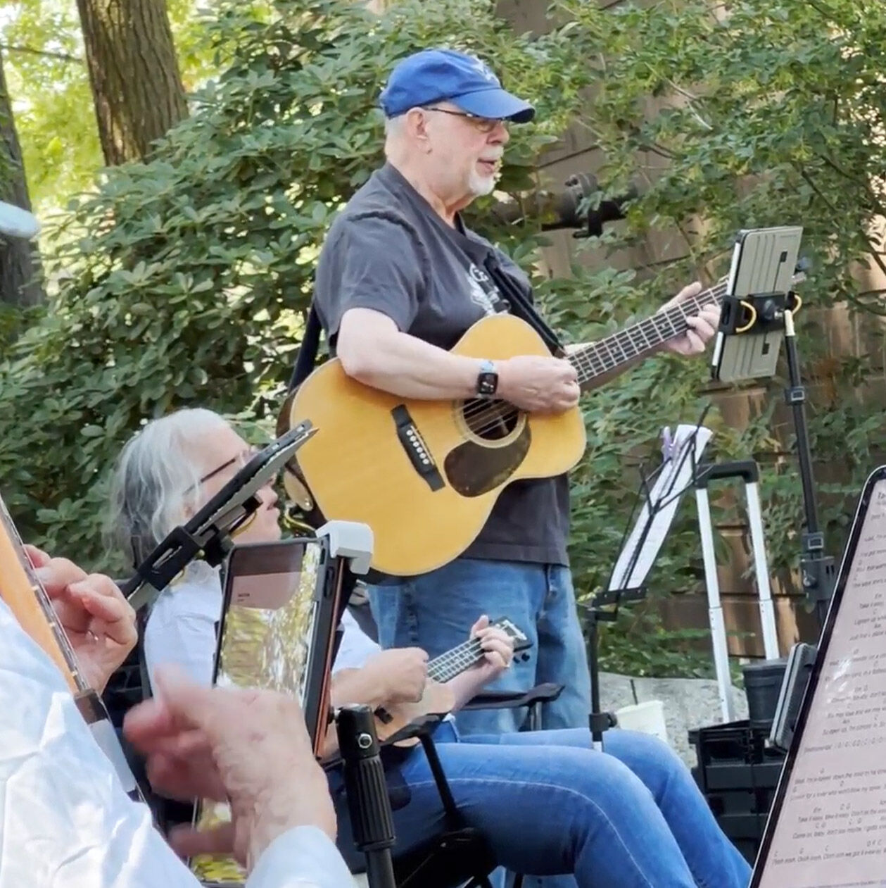 Mickey playing with his ukulele group